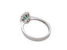 rear white gold cluster ring.

Centre stone is an oval cut emerald, 6x3.7mm (just under 0.50 carats) good deep green hue.