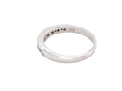 rear An 18 carat white gold half hoop eternity ring. Mixed cuts of white diamonds which consist of seven round brilliant stones, each 2mm diameter and eight baguette cut stones, each 2x1.5mm. Estimated total 0.50 carats.