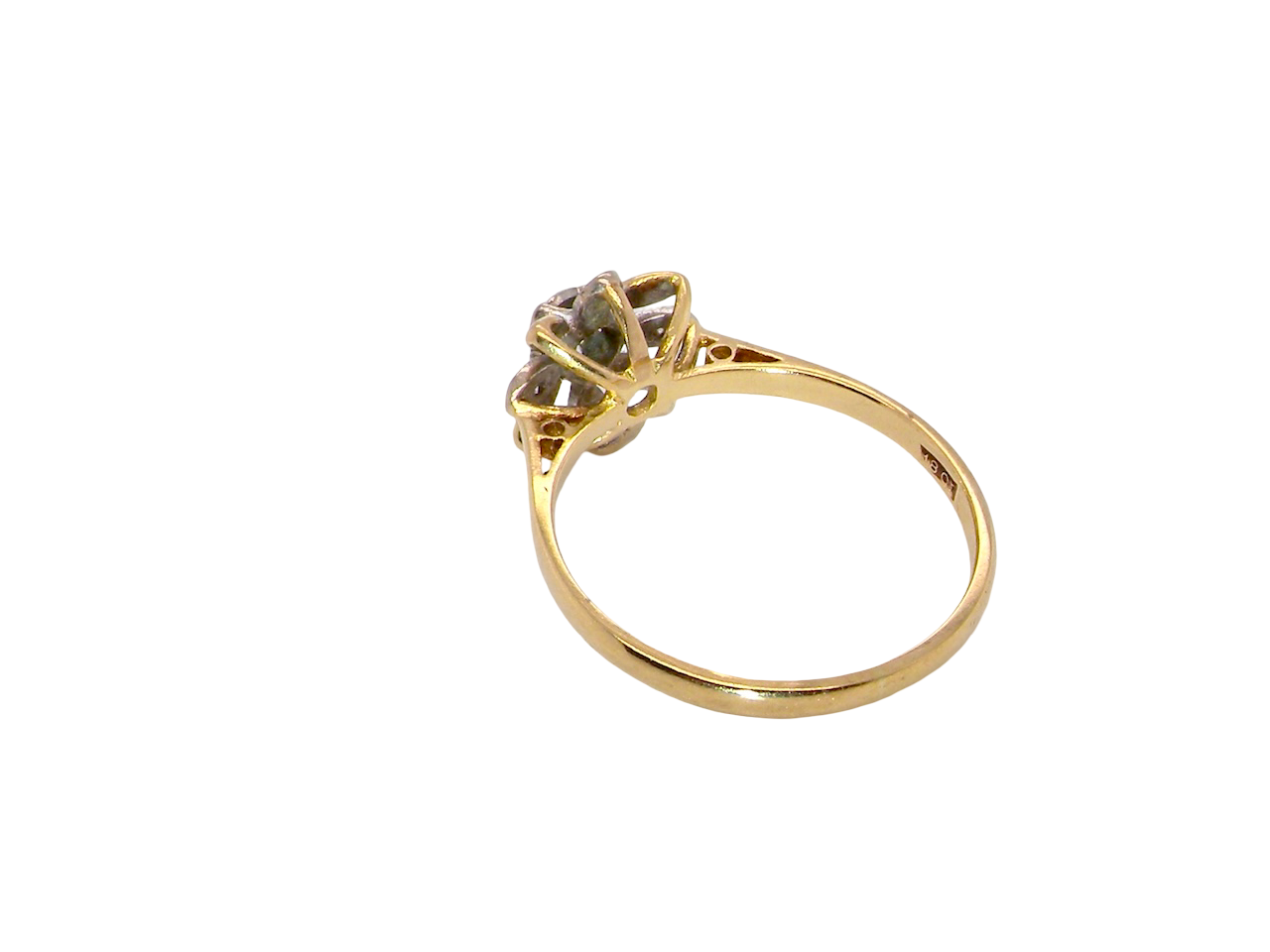 reverse A very pretty cluster ring, a design from the 1950s. Its daisy style was popular during this period, and set with five small white diamonds (total est. 0.05 carats) set into platinum.
