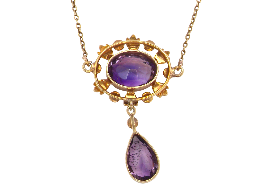 reverse An elegant pendant from the late part of the 19th century. This Victorian pendant features two luxurious amethyst gemstones, 