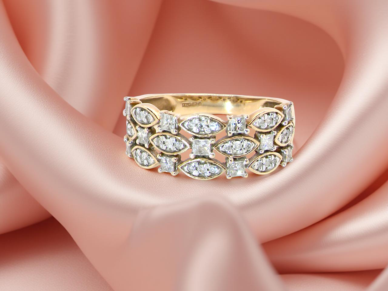 ring featuring three diamond-set bands