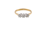  ring is set with three brilliant cut white diamonds, each 3mm diameter. (total estimated at 0.30 carats) Colour h-j, clarity Si. Claw set head, white gold, 