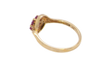 rear A modern 9 carat gold cluster ring. At the centre a small diamond, this complimented by an outer halo of six 2.4mm rubies (each 0.05 carats)