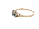 side A 9 carat gold cluster ring. Set to the centre three round emeralds, centre 3.2mm, each side a 2.6mm stone.