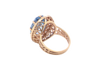 A 9 carat gold dress ring that features a large oval cut blue topaz gemstone. Measures 17x12mm. The head has a pierced outer border,