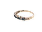 side A 9 carat gold half hoop eternity ring. Set with five blue topaz gem stones, each 2.8mm.&nbsp;
