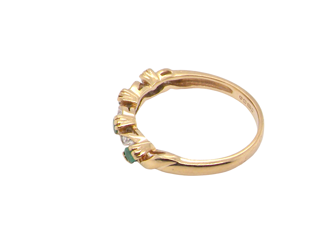 side A 9 carat gold half hoop eternity ring. Set with four 2.4mm emeralds.

Set in alternate sections, a 'lazy S' design,