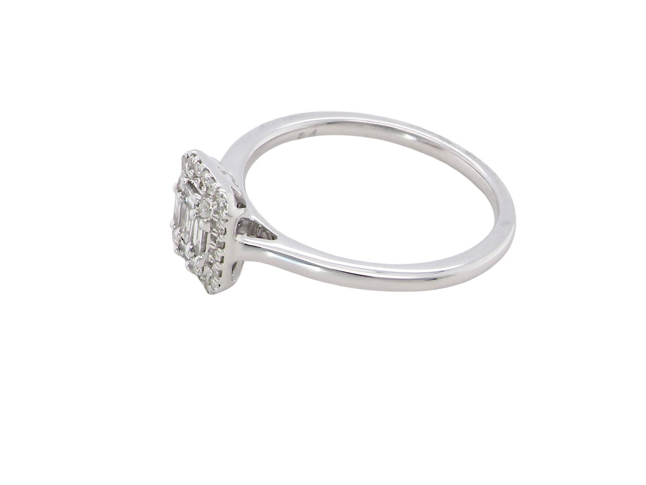 side A 9 carat white gold cluster ring. The centre is set with five baguette cut white diamonds, 3 x 2x1.2mm, 2 x 1mm.
