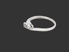 side A 9 carat white gold cross over style trilogy ring. Three x 0.10mm diamonds, to an estimated at 0.30 carats.