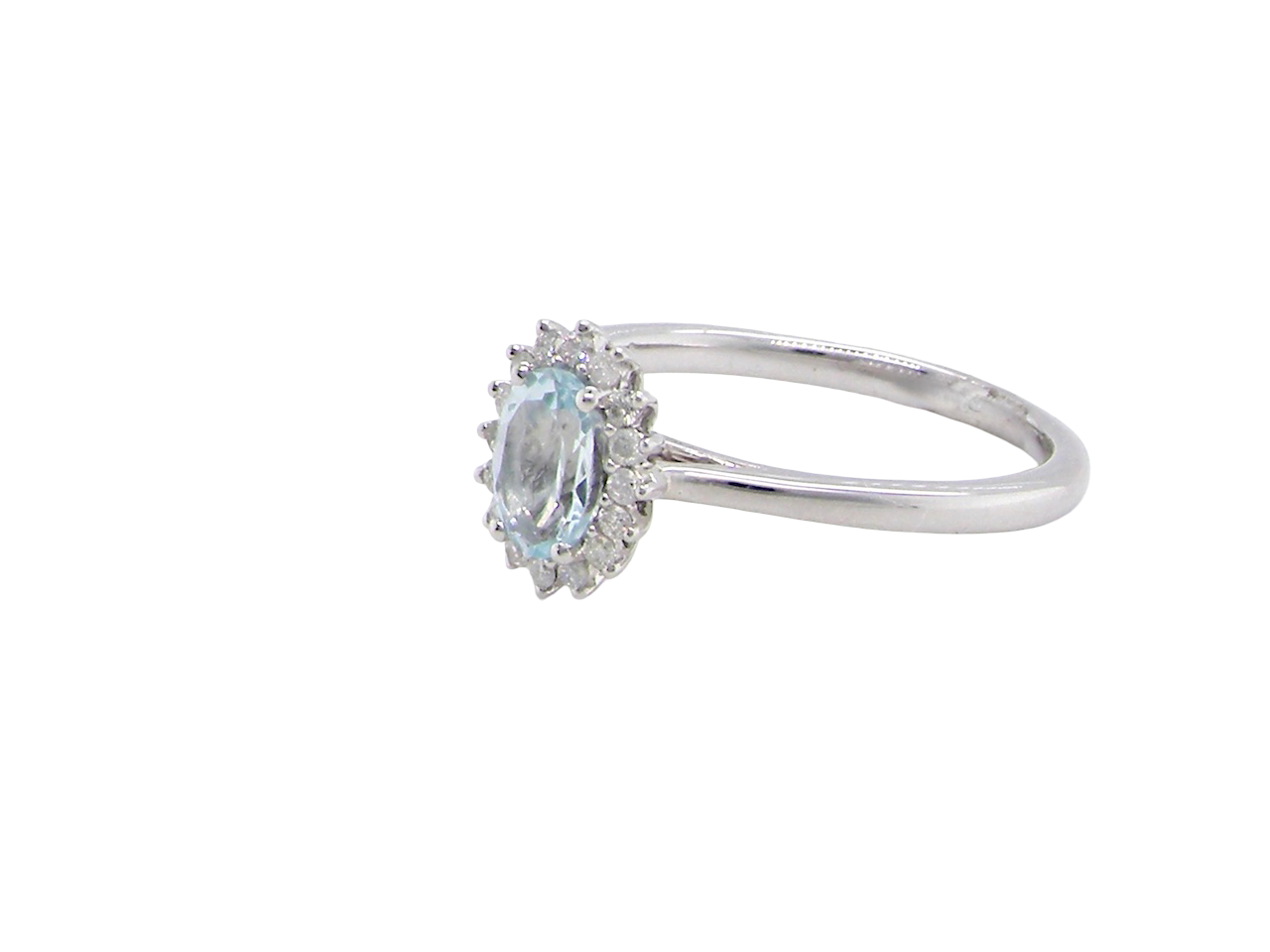 A NEW blue topaz and diamond ring