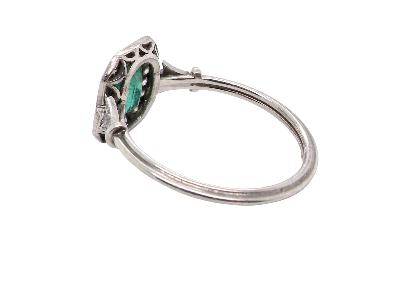 side A beautiful Art Deco cluster ring centred with a vibrant step-cut emerald