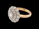 side A beautiful vintage diamond cluster ring.&nbsp; Know as a target cluster, the diamonds are old brilliant cut. Centre diamond 3.8mm (0.20 carats) .&nbsp;
