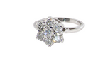 side A beautiful vintage diamond cluster ring, elegantly set with seven brilliant-cut white diamonds in a timeless floral cluster design.