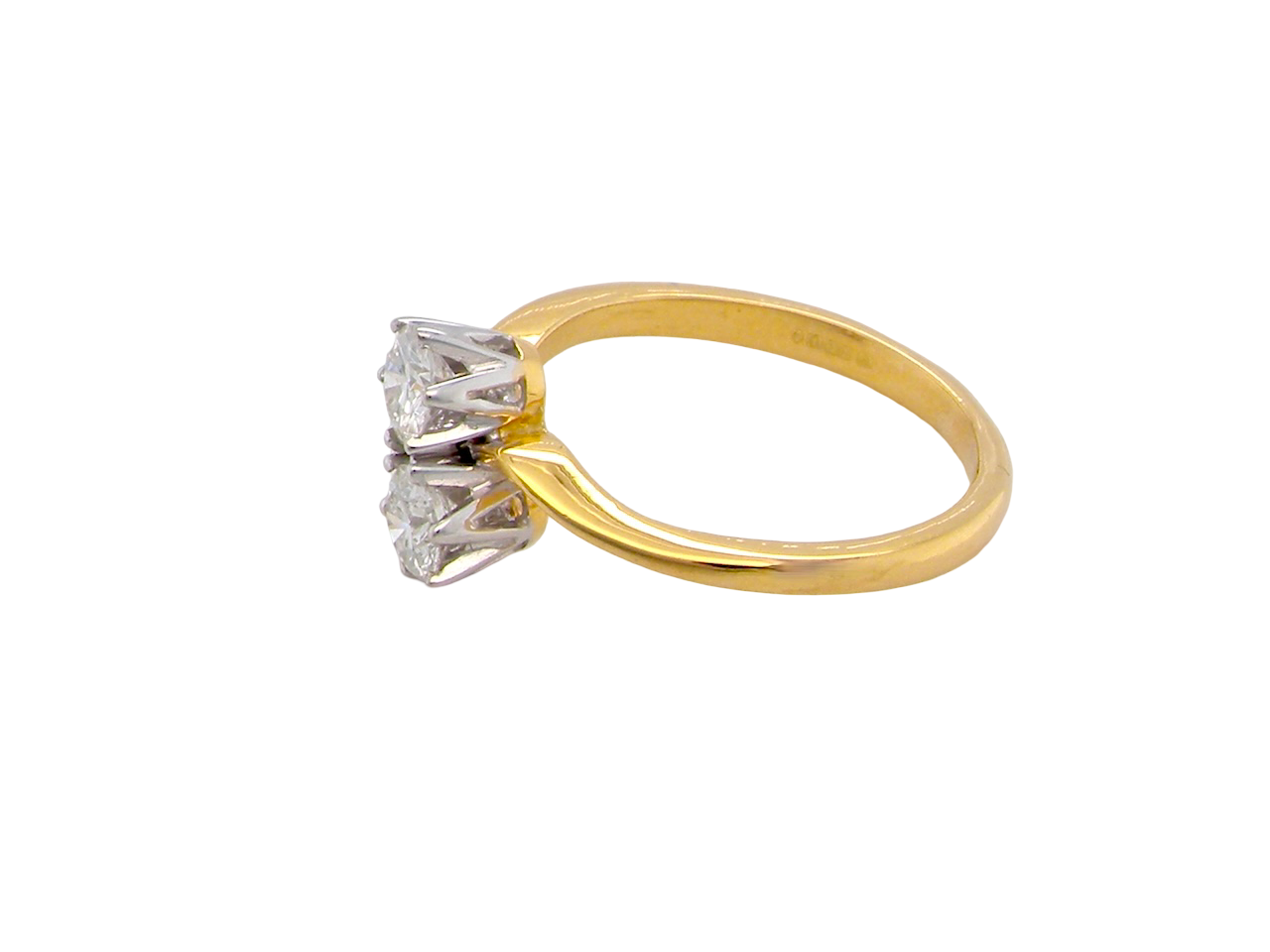 side A beautifully balanced Moi et Toi ring featuring two sparkling modern brilliant-cut diamonds