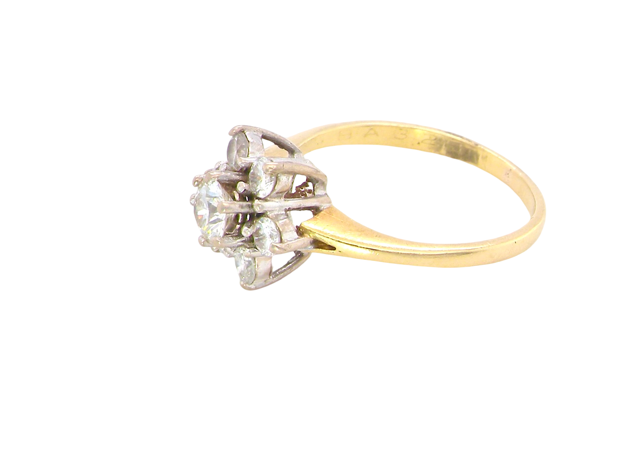 side A beautifully crafted vintage diamond cluster ring, dating to the 1960s, featuring a classic floral-inspired design that remains timeless and elegant.