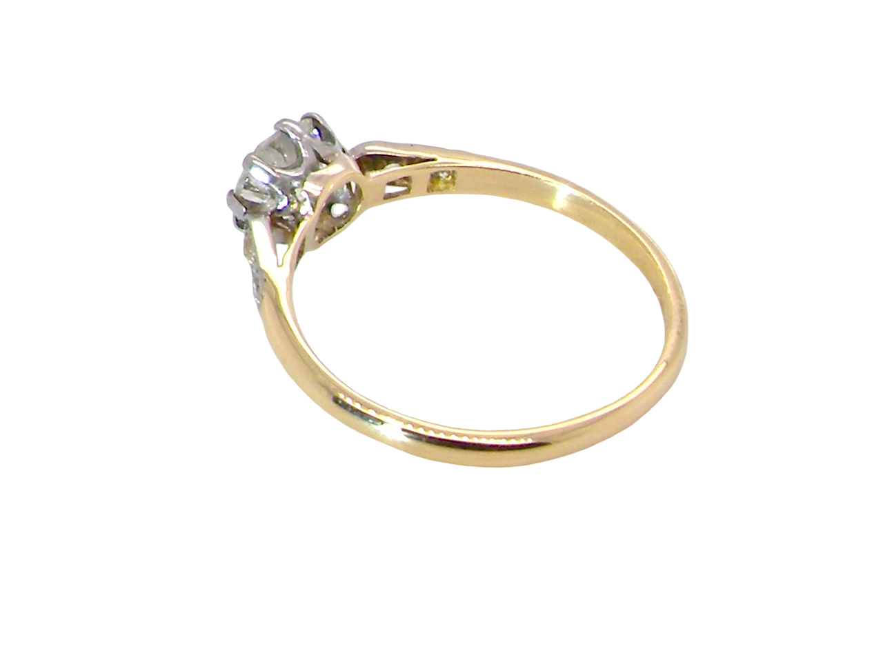 side A beautifully elegant vintage solitaire ring dating to the 1930s, showcasing a classic old brilliant-cut white diamond.

The centre diamond measures approximately 6.2mm 