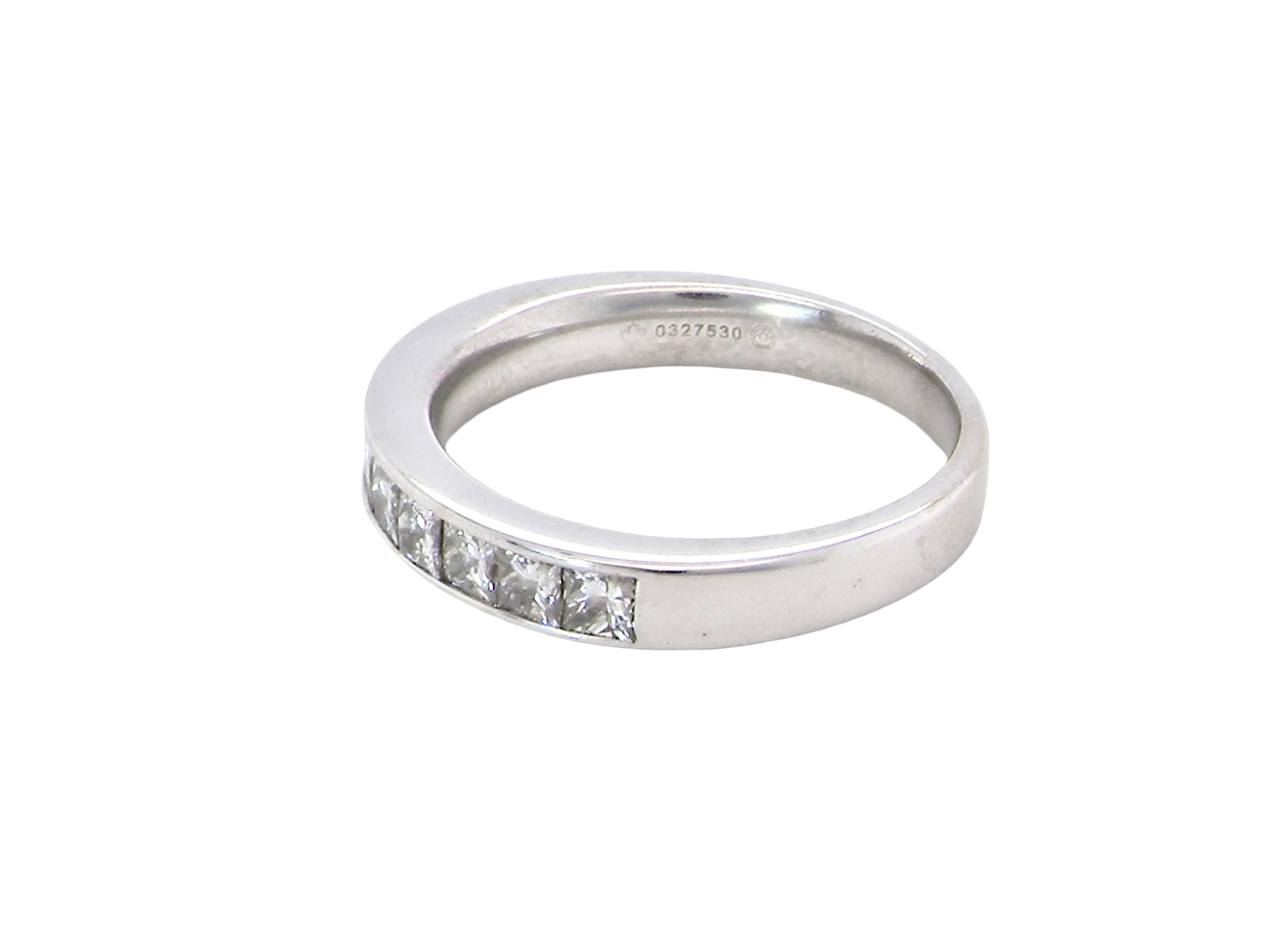 side A fine 18 carat white gold half hoop eternity ring. Set with ten princess cut white diamonds.

Close set, each 2.5x2.5mm, total one carat