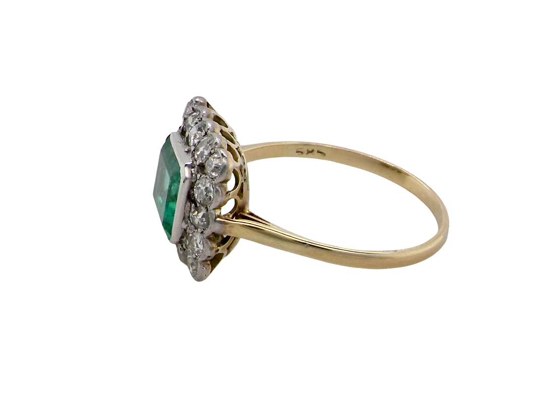 side A fine Art Deco emerald and diamond cluster ring, beautifully proportioned and displaying all the elegance associated with the period.