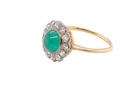 side A fine antique cluster ring. The centre stone a cabouchon cut emerald