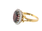 side A fine cluster ring. Features a large garnet centre stone&nbsp;

Complimented by an outer halo of white diamonds.&nbsp;