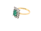 side A fine cluster ring that features a rectangular mid to dark green emerald, measures 8x6mm (est 0.50 carats)&nbsp;
