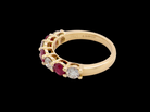 side A fine half hoop ring. 18 carat gold set with three rubies, each 3.8mm (est 0.20 carats, total 0.67 carats) and four brilliant cut white diamonds, each 3.8mm (total 0.85 carats)&nbsp;
