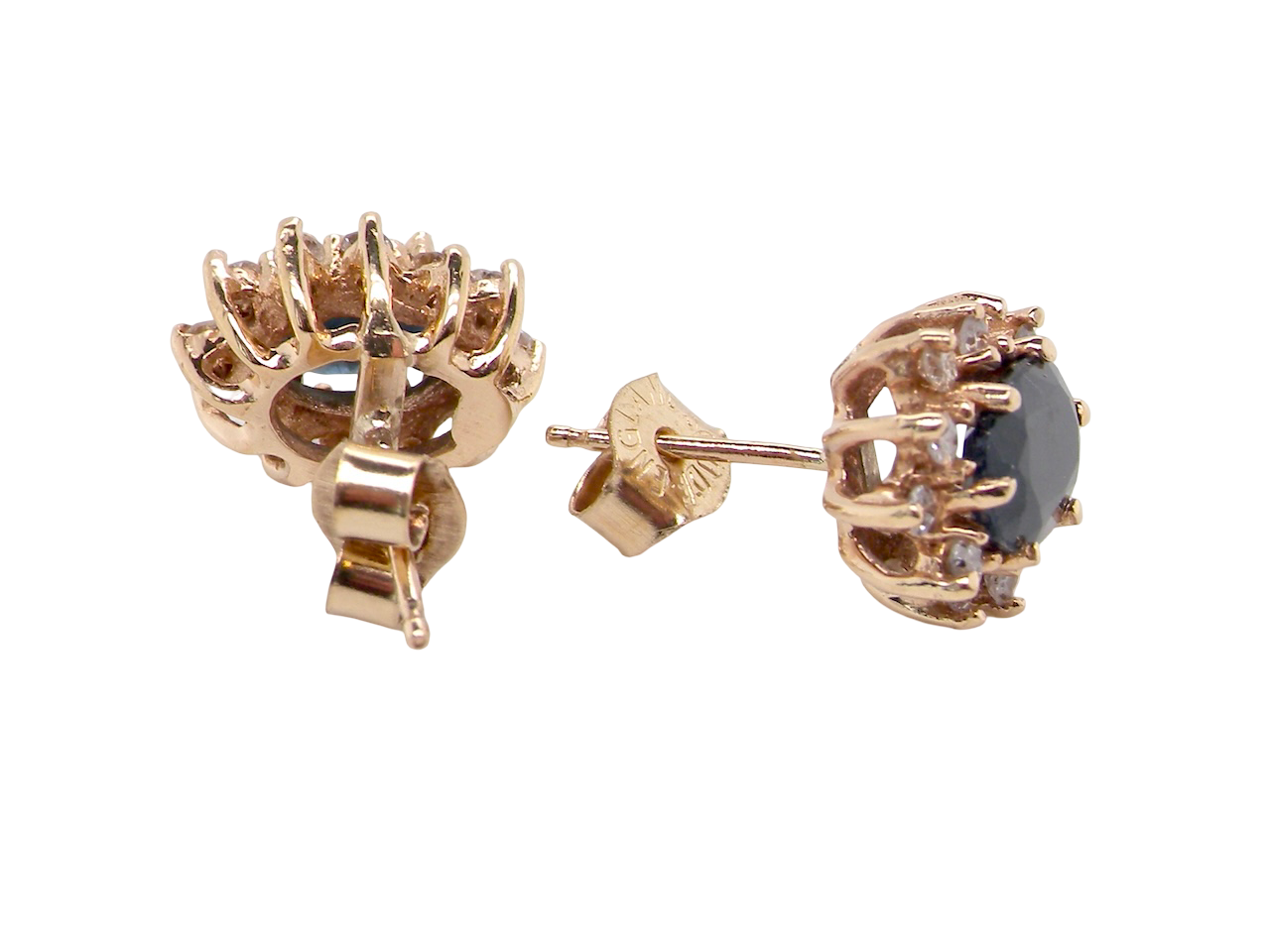 Rose gold earrings with gemstones on a white background