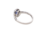 side A fine platinum cluster ring showcasing a vibrant AAA tanzanite
