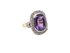 side A fine vintage ring. Features to the centre a large cushion shaped amethyst, 13x10mm, rim setting.
