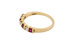 side A half hoop 18 carat yellow gold eternity ring. Set with four bright red rubies, each 2.6mm (total carat weight 0.28 est)