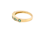 side A half hoop eternity ring. Set with five round emeralds, each 3mm (0.10 carats) and set with an alternate brilliant cut white diamond, 2.4mm each (total 0.20 carats)

