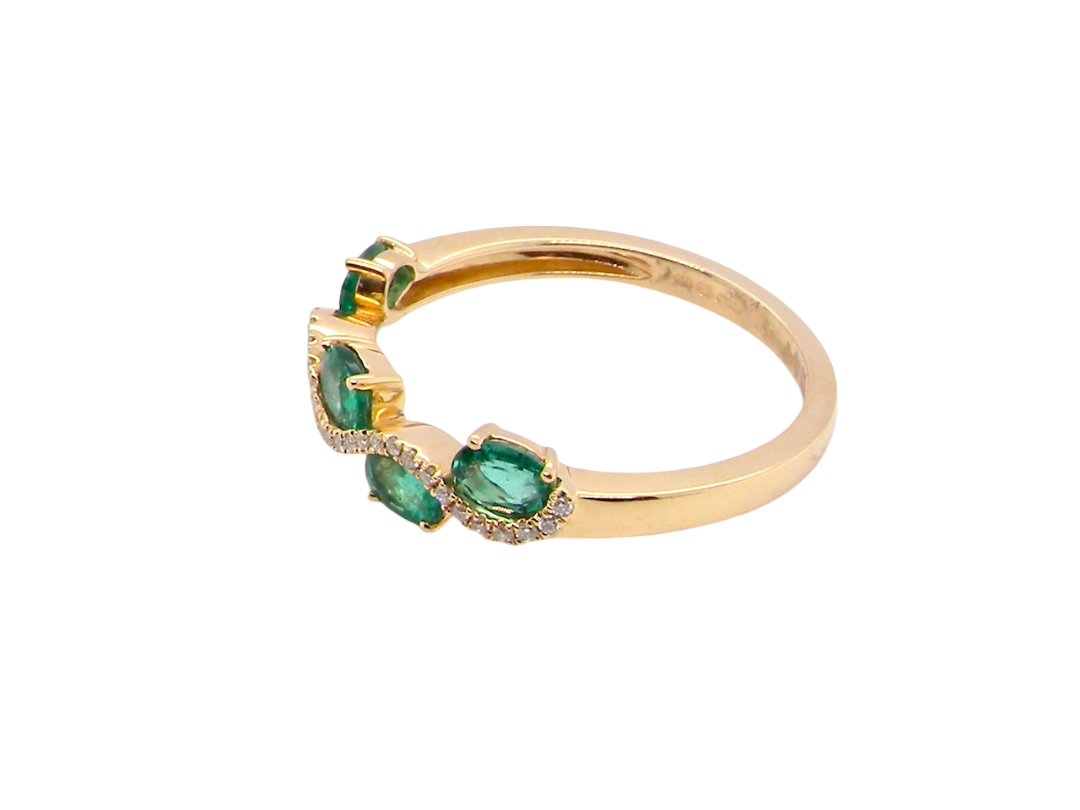 side A half hoop ring with a very attractive line of oval cut emeralds, each 4x3mm, a lovely deep grass green hue, and with very good clarity too.
