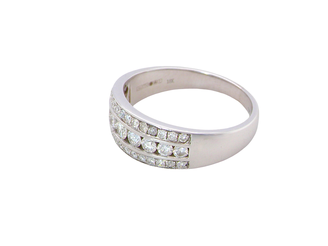 side A lovely 18 carat white gold half hoop ring. Set with a middle row of nine bright white brilliant cut diamonds, graduate from 2.2mm to 2.6mm. The top and bottom rows are also set with small diamonds.