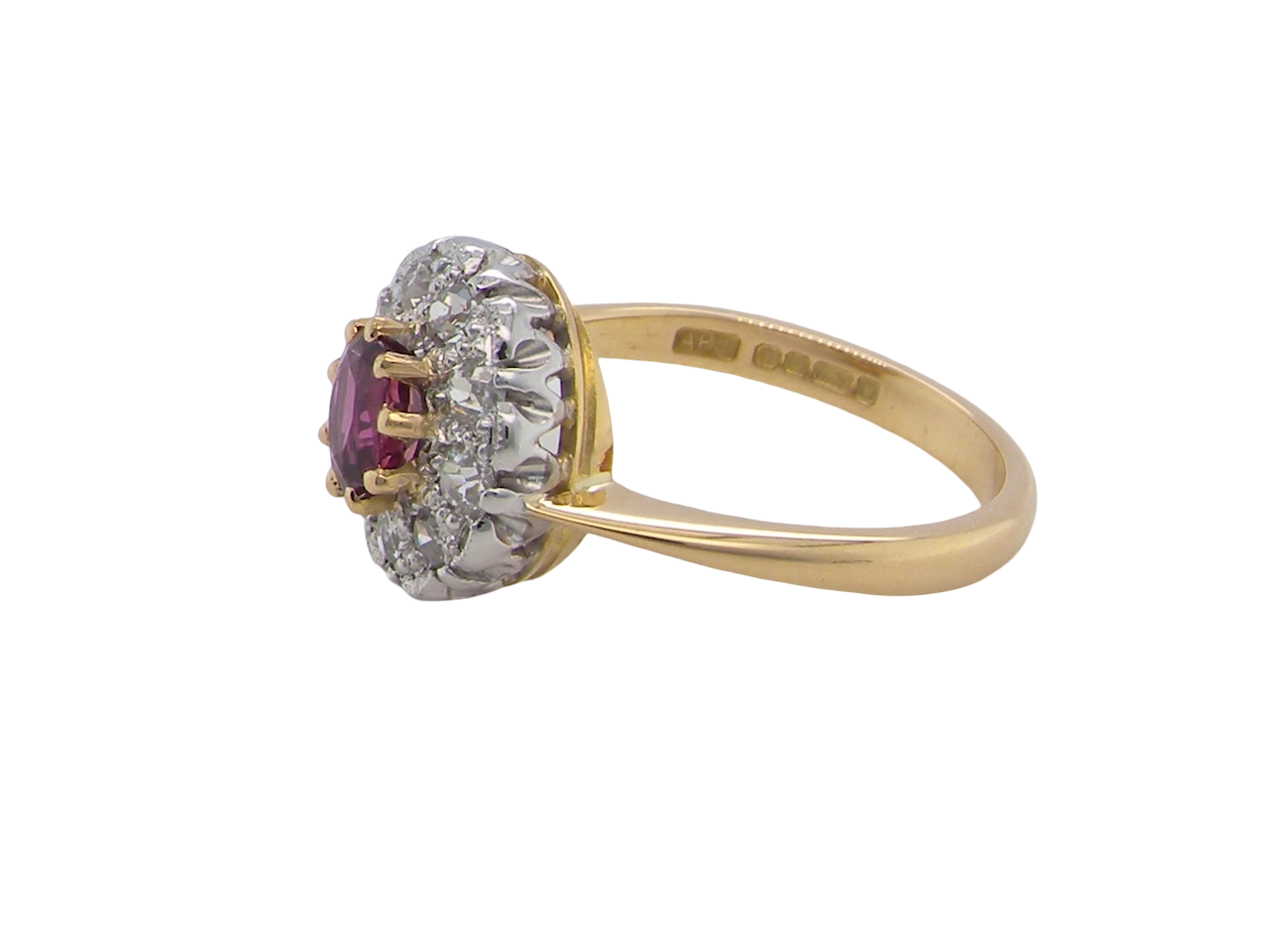 side A lovely daisy cluster ring that profiles to the centre a deep red ruby, 5mm (0.50 carats) yellow claw set.
