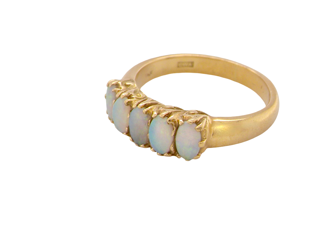 side A lovely five stone ring. Set with five oval white opals, each 5x3.5mm, good play of colour on all.

Carved head 