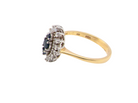 side A navette shaped cluster ring. The centre a line of three sapphires, 0ne x 3.5mm, 2 x 1.5mm.
