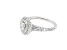 side A new diamond cluster ring* An oval diamond halo cluster ring. Set with brilliant cut white diamonds, colour H-k, clarity Si.