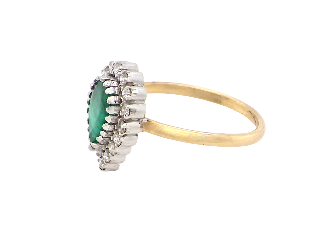 A pear shaped Emerald and Diamond cluster ring