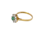 side A pretty 18 carat gold cluster ring. The centre stone is a round emerald 4mm diameter (0.25 carats) mid green colour.
