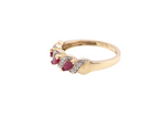 side A pretty 9 carat gold dress ring. The three rubies are marquise cut, 5x3mm each, and set at an angle .