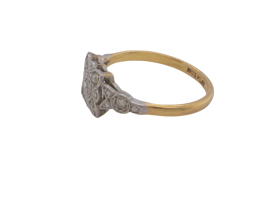 side A pretty diamond cluster ring from the early part of the 20th century. A square head that has within it small white diamonds, measures 8x8mm, fancy shoulders also set with tiny diamonds.
