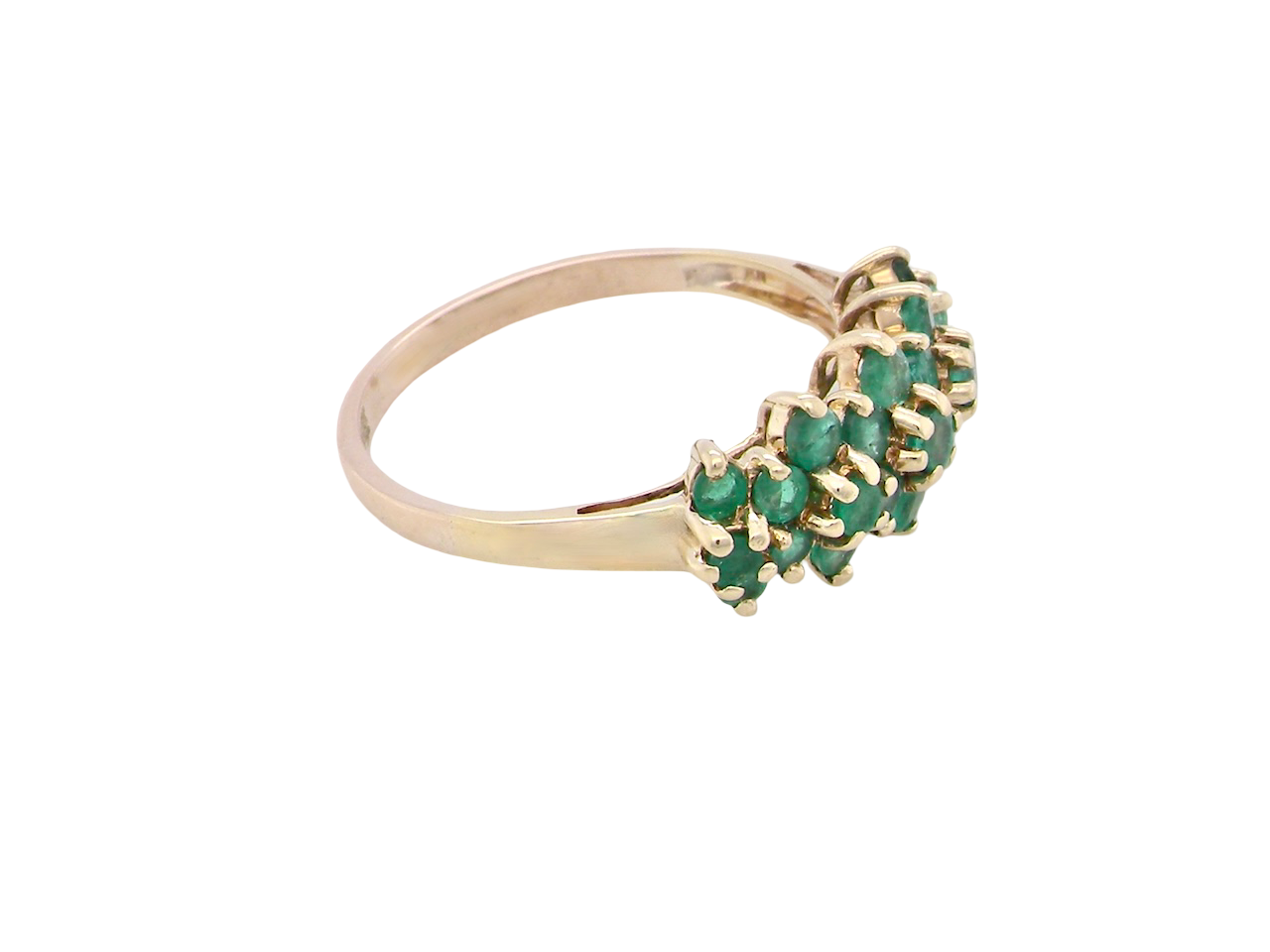 side A striking and unusual dress ring, designed with multiple clusters of round-cut emeralds set beautifully across the finger for a bold, eye-catching look.