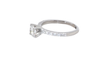 side A stunning 14-carat white gold* solitaire ring featuring a brilliant-cut white diamond.
