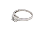 side A stylish modern 18 carat white gold diamond cluster ring, with a beautifully clean and understated design.

The square-shaped head is set with four Princess cut white diamonds,