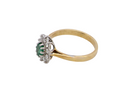 side A traditional cluster ring. Features to the centre an oval shaped emerald, 5.5x4.5mm (est 0.35 carats) deep green colour.&nbsp;
