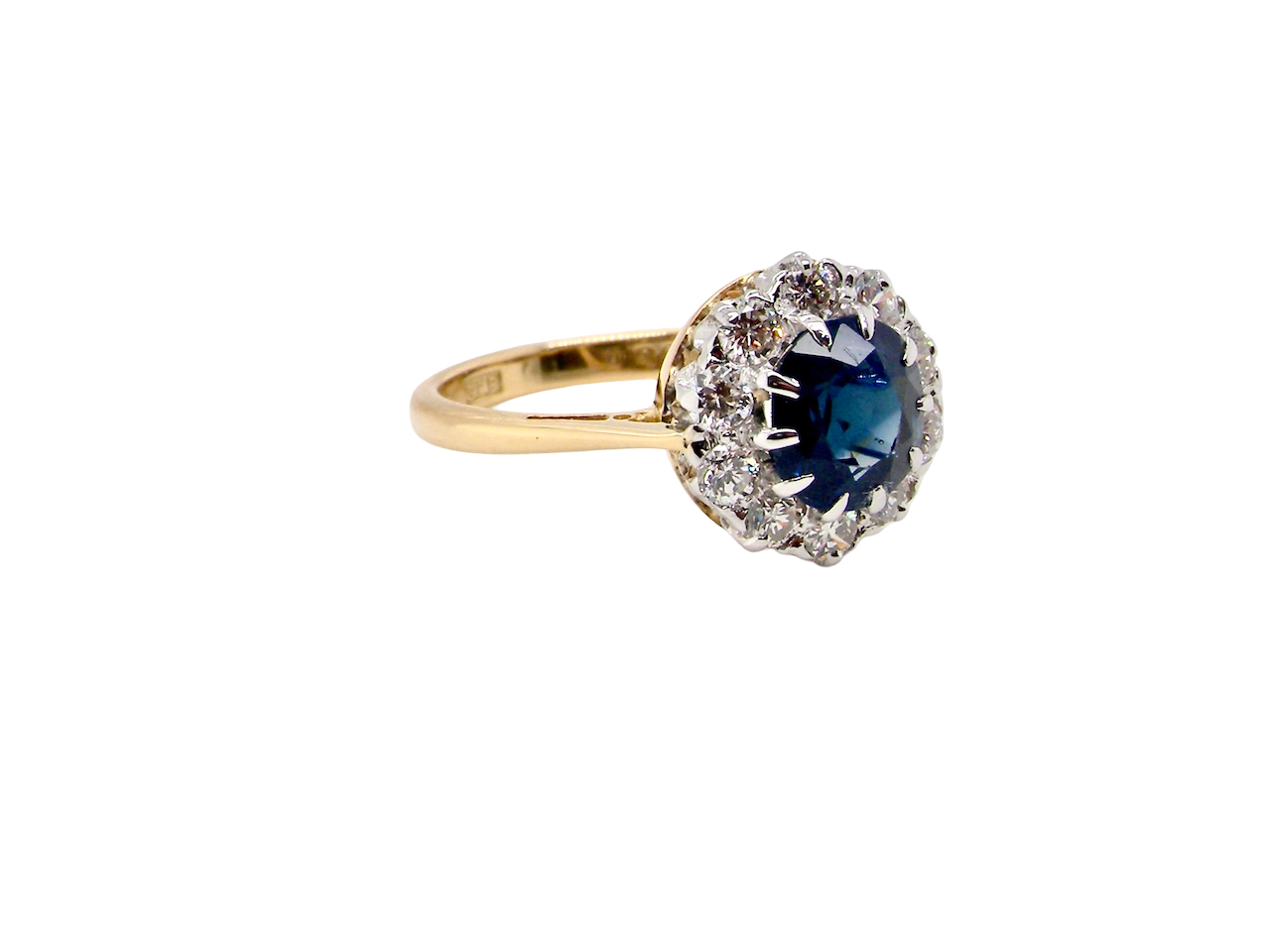 A traditional round cluster- Sapphire and Diamond