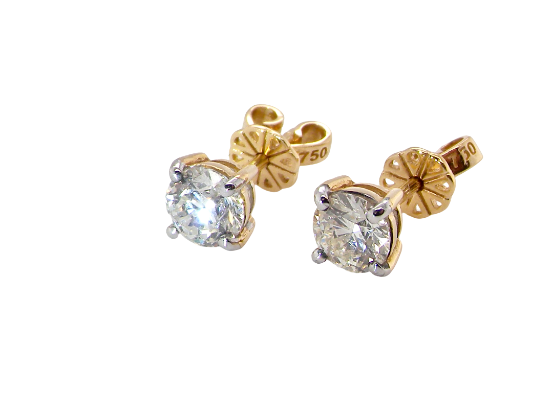 side A truly gorgeous pair of classic diamond stud earrings. Simple, elegant and effortlessly wearable, this timeless design is perfect for both day and evening wear 