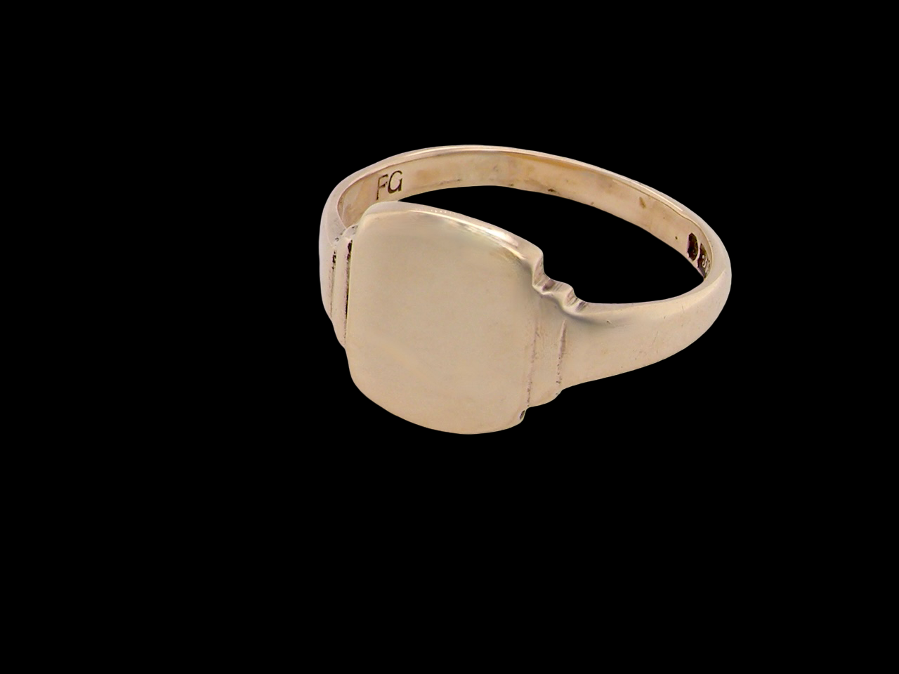 Gold ring on a black background