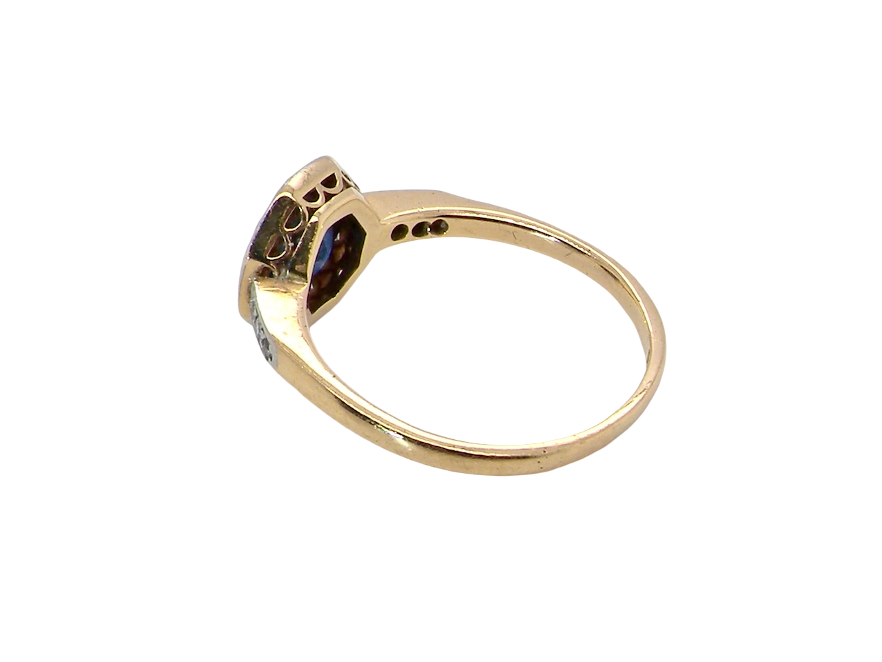 side A very pretty Art Deco cluster ring. To the centre a mid to dark blue sapphire, square cut but set as a 'diamond shape'. Measures 5x5mm, rim setting.