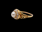 side A very pretty cluster ring set with a central cultured pearl